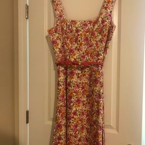 Beautiful floral print sundress in pinks, yellows, orange and green.